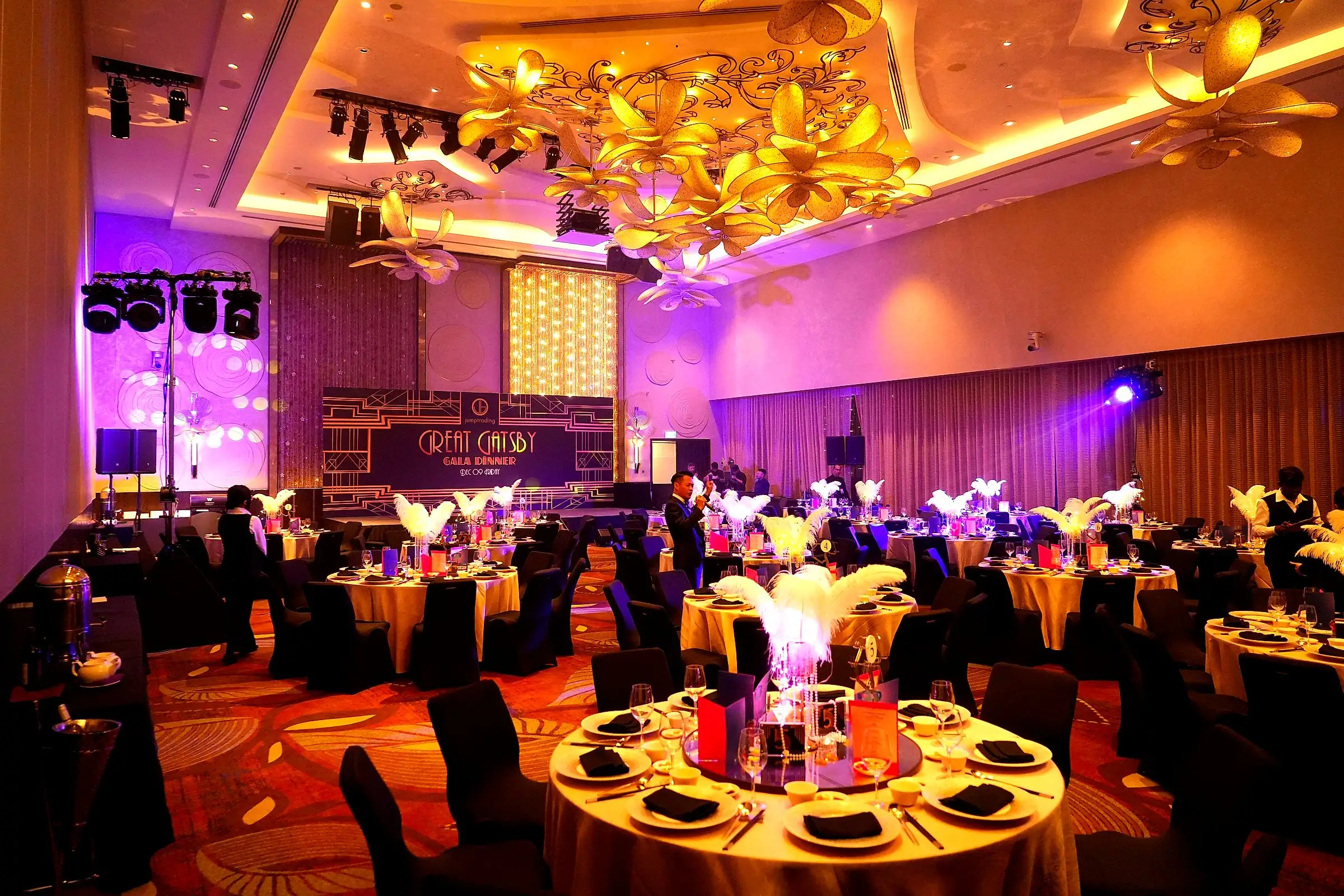 Gala dinner in full swing under purple stage lighting